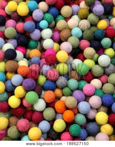 background of multicolored felt small balls for sale