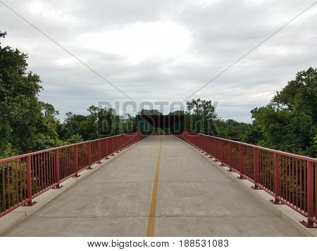 bike and walking path with red metal railing