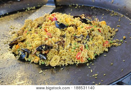 Pan Of Spanish Restaurant With Tasty Paella With Yellow Rice And