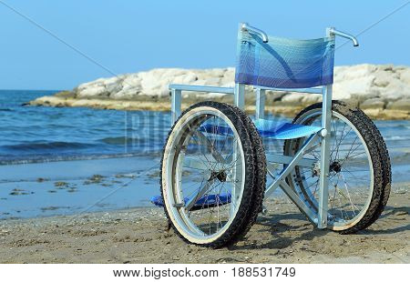 Special Wheelchair With Aluminum Tubes To Enter Into The Sea