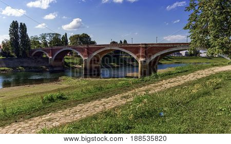 Old bridge over the Kupa river in Sisak by day, Croatia