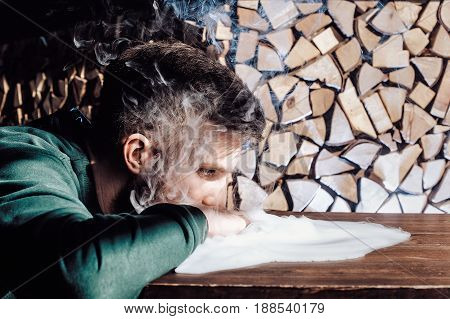 Young Handsome Guy Smoking Hookah Alone Closeup