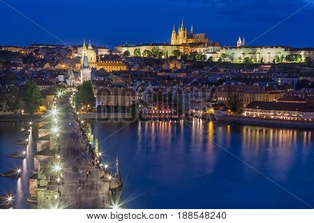 View of Charles Bridge Prague Castle and Vltava river in Prague Czech Republic during blue hour.