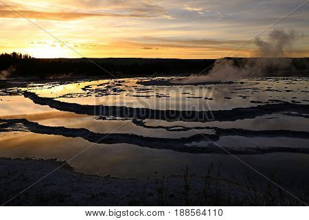 Great Fountain Geyser at Sunset, in Yellowstone National Park, WY, USA