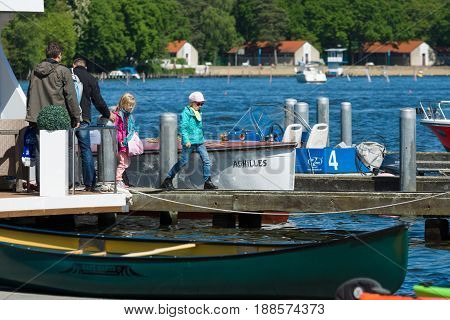 BERLIN GERMANY - MAY 03 2014: Sport boats kayaks and canoes at the marina. 2nd Berlin watersports festival in Gruenau on the river Dahme tributary of the river Spree
