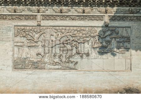 Heaven tree engraved on the wall of the Giant Wild Goose Pagoda complex. Xi'an, Shaanxi province, China, January 2017.