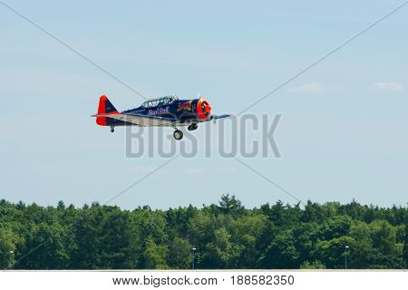 BERLIN GERMANY - MAY 21 2014: Demonstration flight of a single-engined advanced trainer aircraft North American T-6 Texan. Flying Bulls Team. Exhibition ILA Berlin Air Show 2014