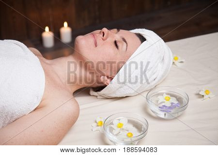 beautiful woman lies in the sauna spa relax massage