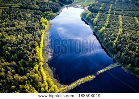 Aerial View Of Beautiful Evening In The Nature. Forest And Lake From A Drone