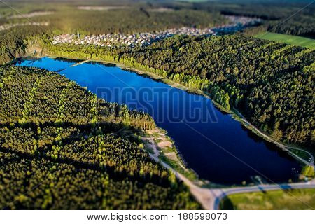Aerial View Of Beautiful Evening In The Nature. Forest And Lake From A Drone