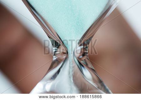 Hand Holds Hourglass Close-up.