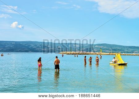 People In Adriatic Sea In Omis