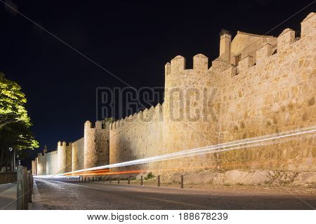 Walls Of The Historic City Of Avila At Night With A Car Light Trail, Castilla Y Leon, Spain