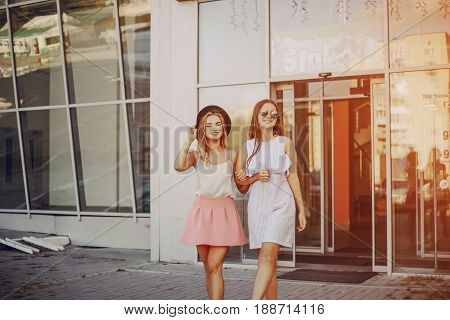 two girls walking city  