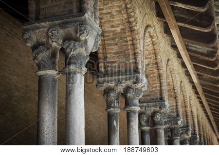 Columns and arches of cloister in old Dominican monastery Couvent des Jacobins in Toulouse, France. Architectural details.