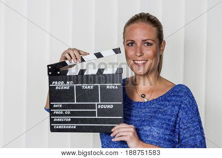 woman with clapperboard