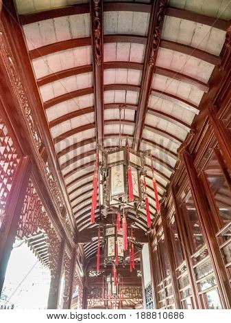 Shanghai, China - Nov 4, 2016: In Yu Yuan (Yu Garden) - Traditional Chinese lanterns adorn the ceiling of a corridor.