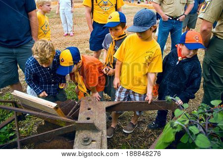 GRANITE BAY, CALIFORNIA, USA - October 18, 2009: Cub Scouts examine antique farm machinery while on a field trip to a pumpkin farm