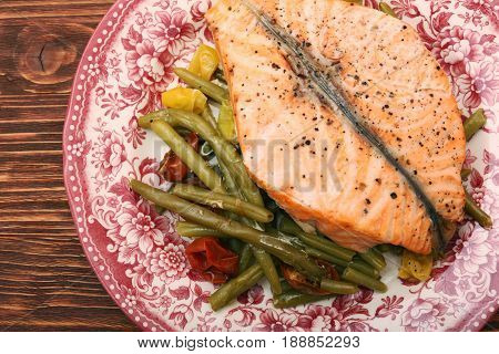 Salmon steak, veggies and herbs. Healthy eating concept