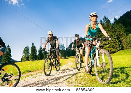 family of four cycling by the vilsalpsee in austria