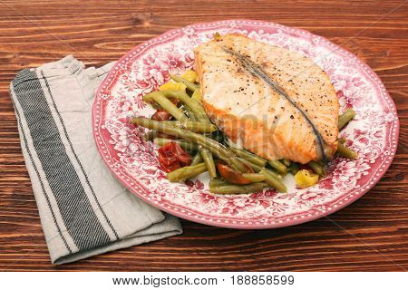 Salmon steak, veggies and herbs. Healthy eating concept