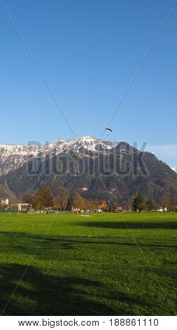 Paragliding with snow mountain and blue sky background