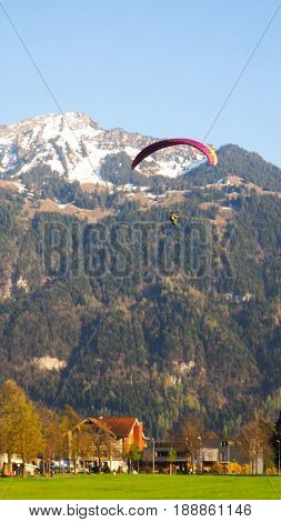 Paragliding with snow mountain and blue sky background