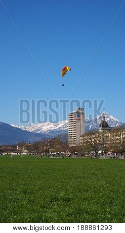 Paragliding with snow mountain and blue sky background