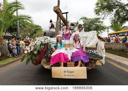 FUNCHAL PORTUGAL - SEPTEMBER 4 2016: Group of people in traditional costume durnig historical and ethnographic parade of Madeira Wine Festival in Funchal. Madeira Portugal