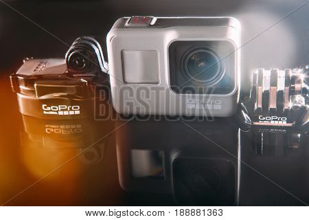 Kharkov, Ukraine - April 13, 2017: GoPro HERO 5 action camera with accessories on black background. Compact gadget waterproof, support 4k video, voice controls and is often used in extreme photography