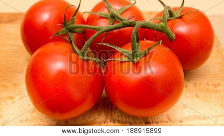 Top View Of Red Tomatoes On Wooden Table