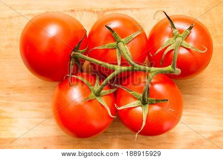 Top View Of Red Tomatoes On Wooden Table