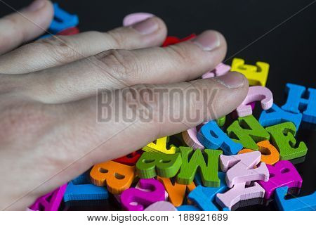 Hand Over The Colored Letters.