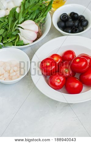 Ingredients For Healthy Salad. Tomatoes, Rucola (eruca Sativa), Spring Onion, Mozzarella, Olives, Ga