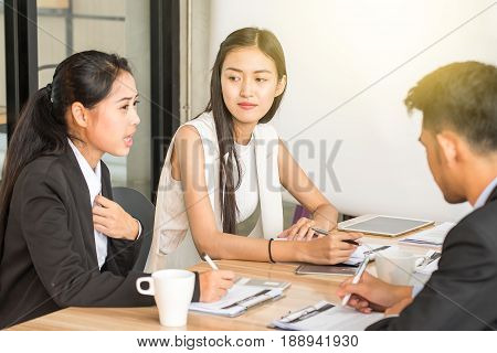 Businesspeople discussing together in conference room during meeting at office