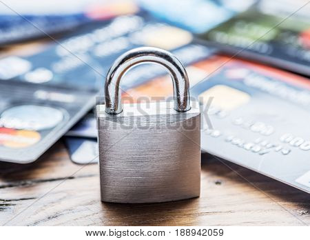 Credit cards and simle mechanical lock. Security concept.