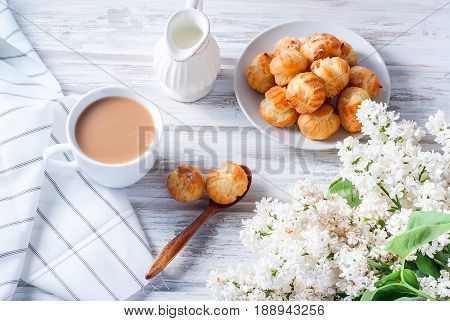 Coffee And Eclairs On A White Background