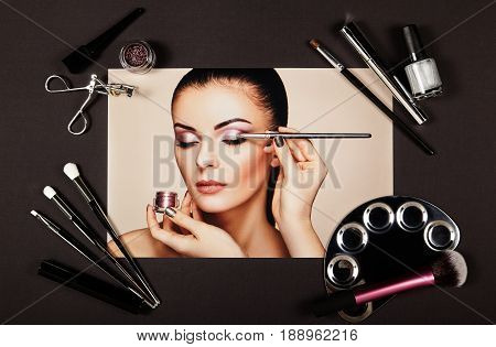 Fashion lady accessories collage. Falt Lay. Beauty photography. Make-Up brushes. Jewelry and nail polish. Makeup artist applies eye shadow. Nails and manicure