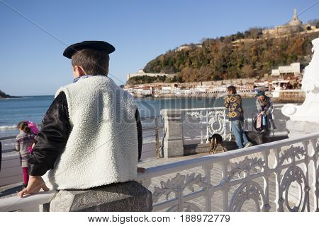 DONOSTI-DECEMBER 21 2014: Boy dressed in typical costume in Donosti celebrating Santo Tomas day, Spain on December 21, 2014