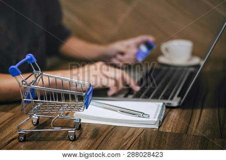 Businessman Holding Credit Card And Typing On Laptop For Online Shopping And Payment Makes A Purchas