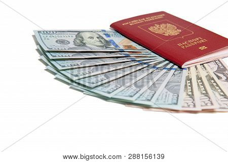 Biometric Passport And Two Banknotes For A Hundred Dollars Visa Free Travel. Travel Expenses Concept