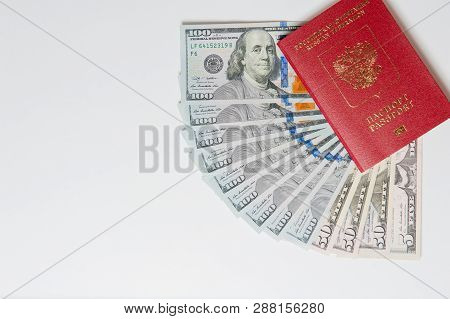 Biometric Passport And Two Banknotes For A Hundred Dollars Visa Free Travel. Travel Expenses Concept
