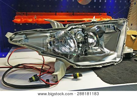 Macro View Of Repairing, Installation And Turning Headlight Of Modern Automobile And Car Projector L