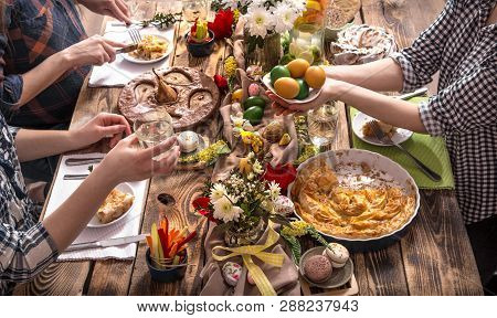 Home Celebration Of Friends Or Family At The Festive Easter Table With Easter Cake, Top View, Celebr