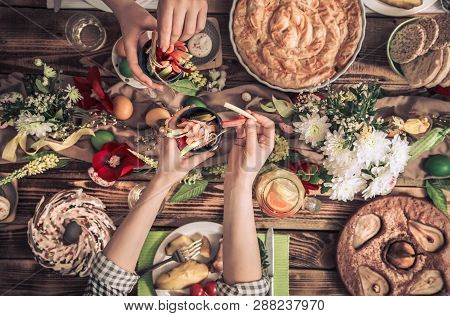 Home Celebration Of Friends Or Family At The Festive Easter Table With Easter Cake, Top View, Celebr