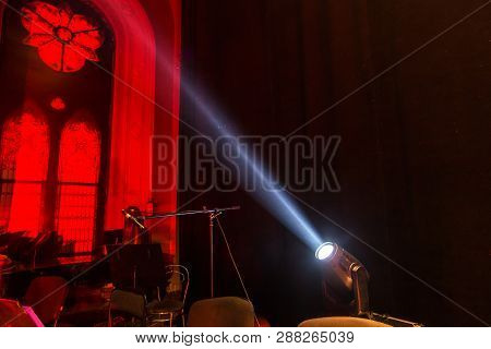 Stage Lights. Several Projectors In The Dark. Multi-colored Light Beams From The Stage Spotlights On