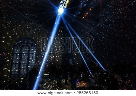 Stage Lights. Several Projectors In The Dark. Multi-colored Light Beams From The Stage Spotlights On