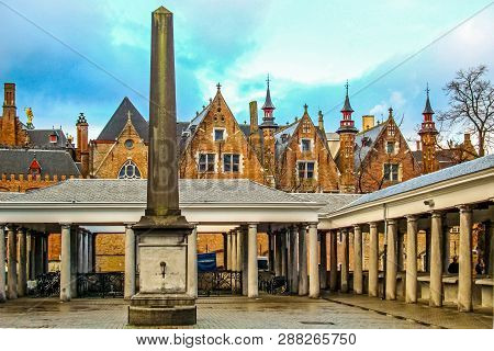 Old Fish Market Called Vismarkt And Medieval Historical Buildings Of Bruges Belgium