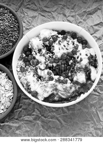 Delicious And Healthy Breakfast With Oat Flakes, Yoghurt, Flaxseed And Cowberry. Energy Breakfast Co