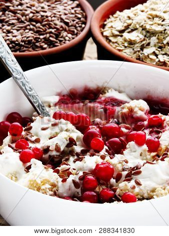 Delicious And Healthy Breakfast With Oat Flakes, Yoghurt, Flaxseed And Cowberry. Energy Breakfast Co